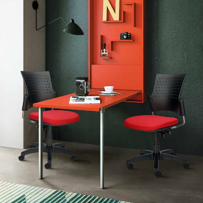 Two small red chairs at work table