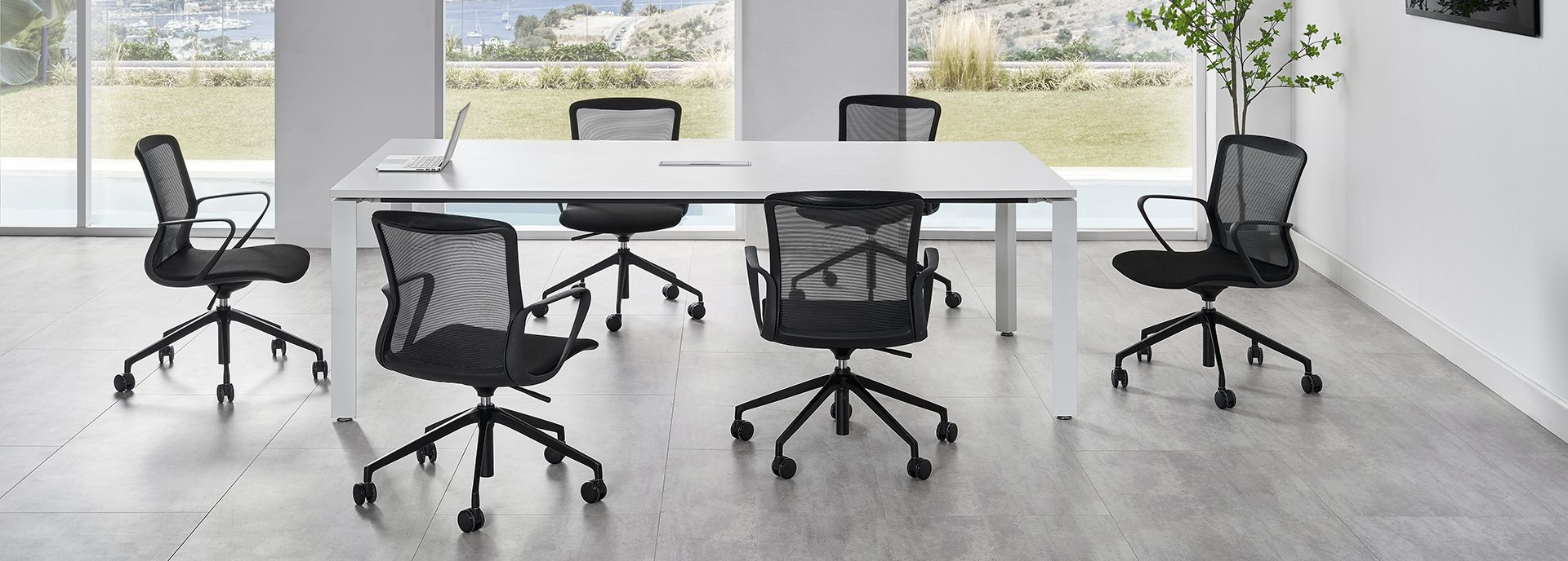 Mesh-back multi-purpose Keen Chairs around conference table