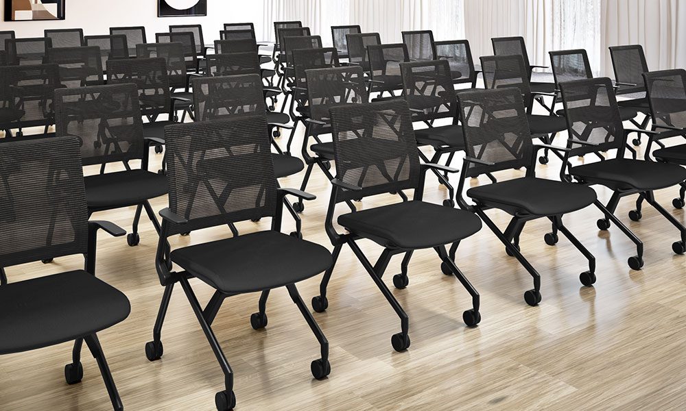 Black nesting chairs with arms and mesh back