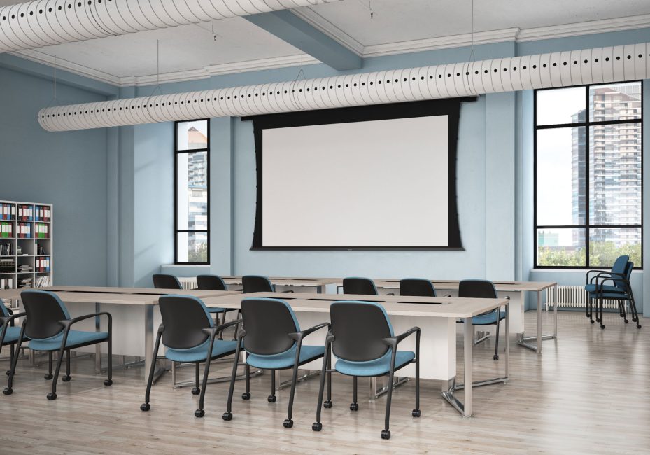 Teal and black stacking chairs in classroom